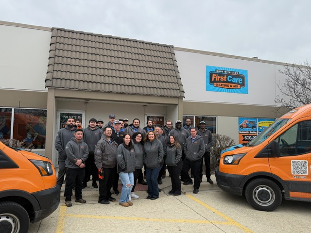 The team at First Care posing in front of their office in Naperville