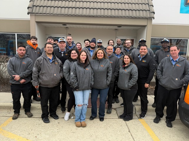 First Care team standing in front of their office