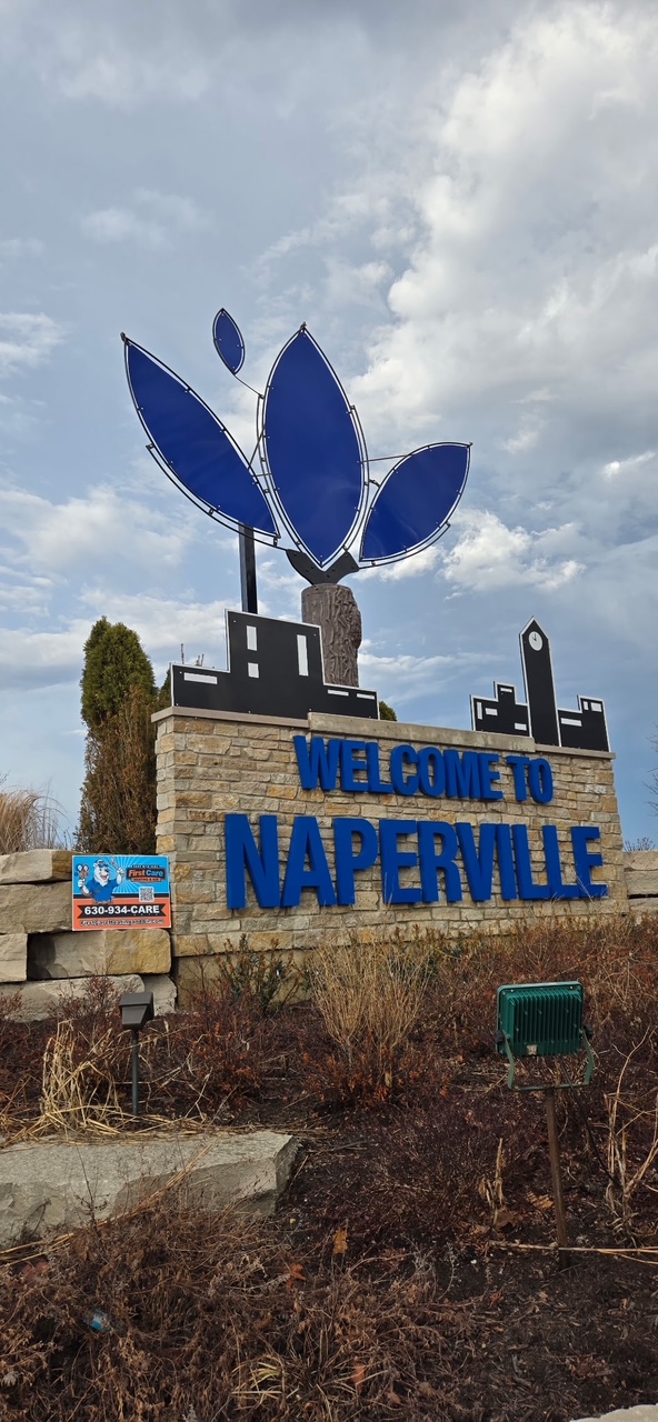 A First Care technician working on an AC in Naperville