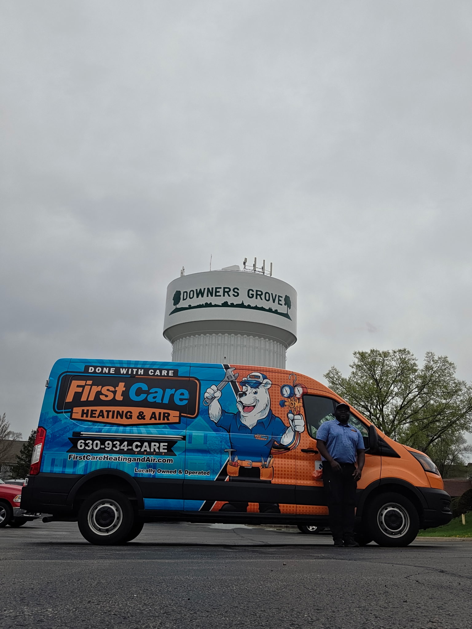 Some First Care Heating and Air LLC technicians checking out company pictures