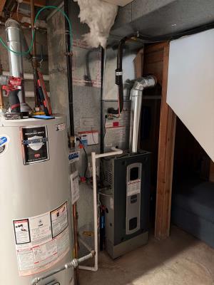 Technician inspecting a newly installed condensate line.